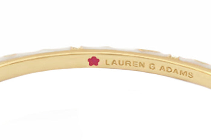 The plum-flower maker&rsquo;s mark inside a bangle